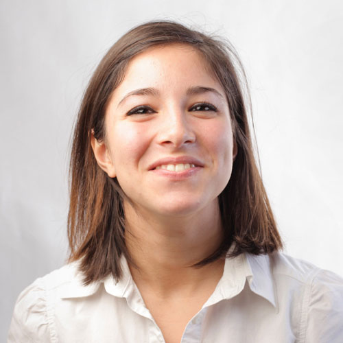 A beautiful Lady is smiling earing a white shirt